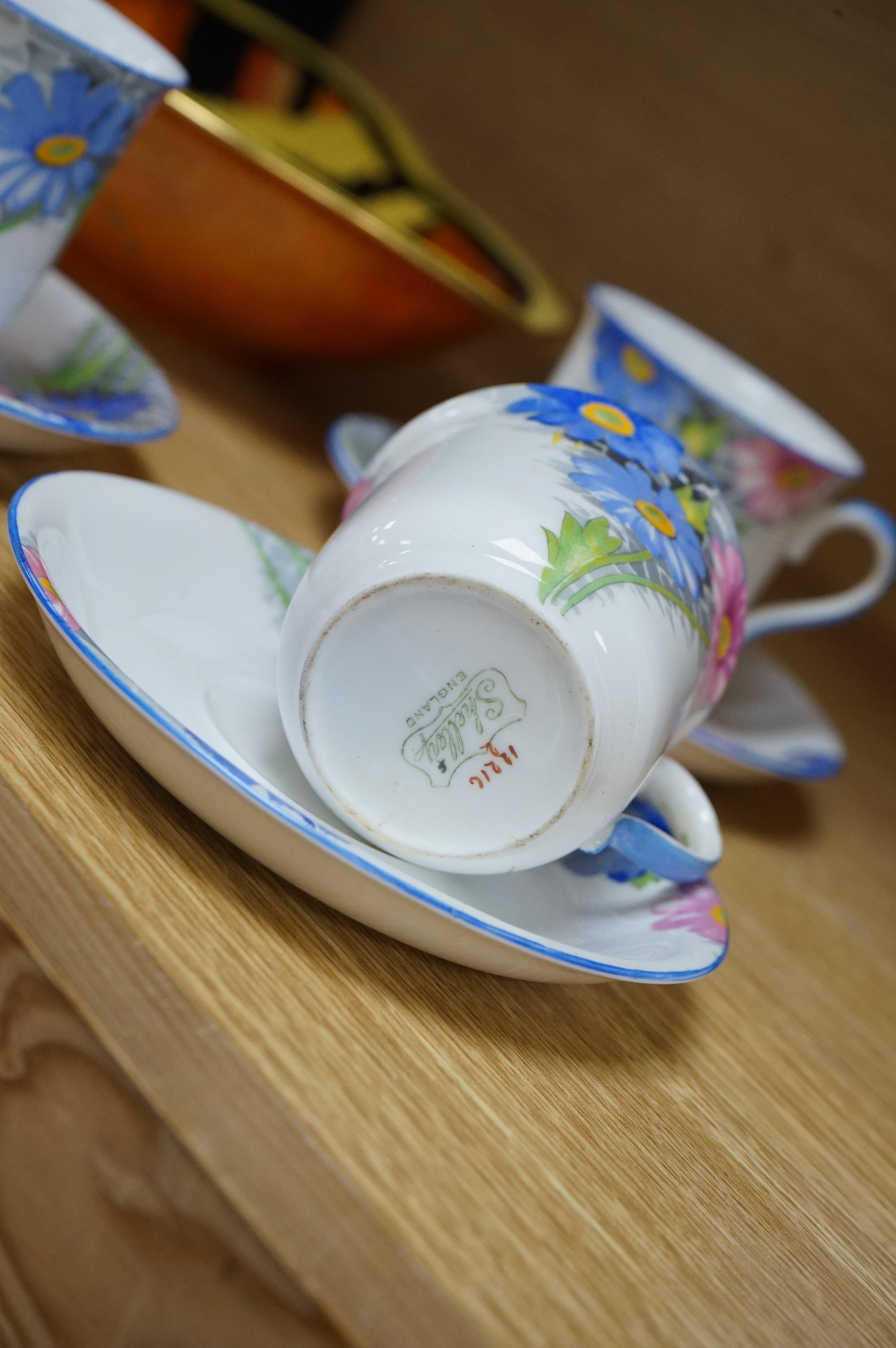 A Shelley porcelain coffee set and a Carltonware Jazz pattern dish, largest 23cm high. Condition - good